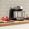Robot de bucătărie planetar BOSCH Serie S2 MUMS2 MUMS2VM00, 900W (7 trepte și Pulse), Bol inox 3.8l, Set patiserie, Soft Start, Design compact, Control electronic al puterii, G4.4kg, Black and Silver