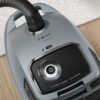 Aspirator cu sac BOSCH Serie 6 BGB6X330, Aspirare uscată, 600W, Sac 4l, Cablu 9.3m, 4 roți, Filtru igienic lavabil HEPA, Telecomandă mâner, Iluminare LED, Perie mobilier, Perie parchet, 75dBA, G4.3kg, Graphite